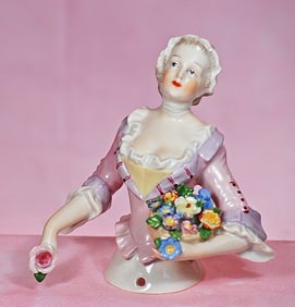 GERMAN PORCELAIN HALF DOLL OF BUXOM LADY WITH BASKET OF FLOWERS