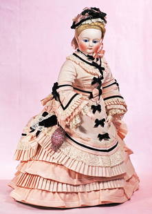 FRENCH BISQUE POUPEE: FRENCH BISQUE POUPEE. 16”. Marks: None. Bisque swivel head on bisque shoulderplate, inset almond-shaped blue glass eyes, dark eyeliner, painted lashes, arched and tapered brows, closed mouth, pl