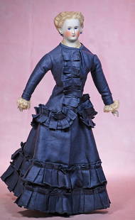 GERMAN BISQUE LADY WITH SCULPTED HAIR AND PIERCED EARS: GERMAN BISQUE LADY WITH SCULPTED HAIR AND PIERCED EARS. 15”. Bisque shoulderhead with sculpted blonde hair waved away from face with cluster of ringlet curls at the back, painted features,