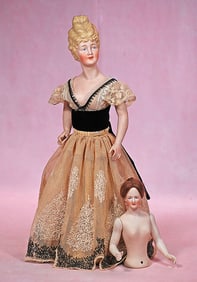 TWO GERMAN BISQUE HALF DOLLS WITH JOINTED SHOULDERS