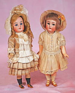 TWO PETITE GERMAN BISQUE DOLLS: TWO PETITE GERMAN BISQUE DOLLS. 9&#8221;. Each is bisque socket head with open mouth, mohair wig, five-piece jointed composition body with painted stockings and shoes. Doll marked Gbr-K by Gebruder Ku