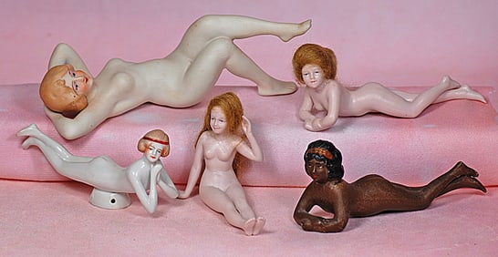 FIVE ALL-BISQUE AND PORCELAIN BATHING BEAUTY DOLLS