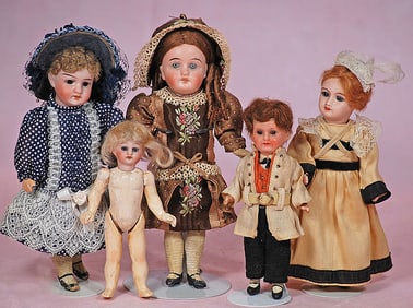 FIVE MINIATURE BISQUE DOLLS