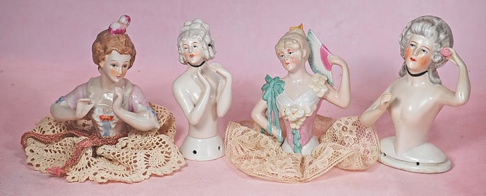 FOUR GERMAN PORCELAIN HALF DOLLS