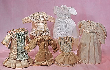 SIX DOLL DRESSES