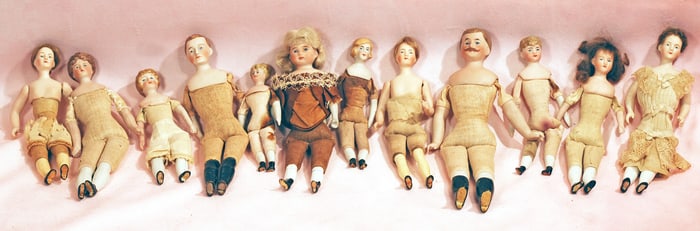 TWELVE GERMAN BISQUE DOLLHOUSE DOLLS.