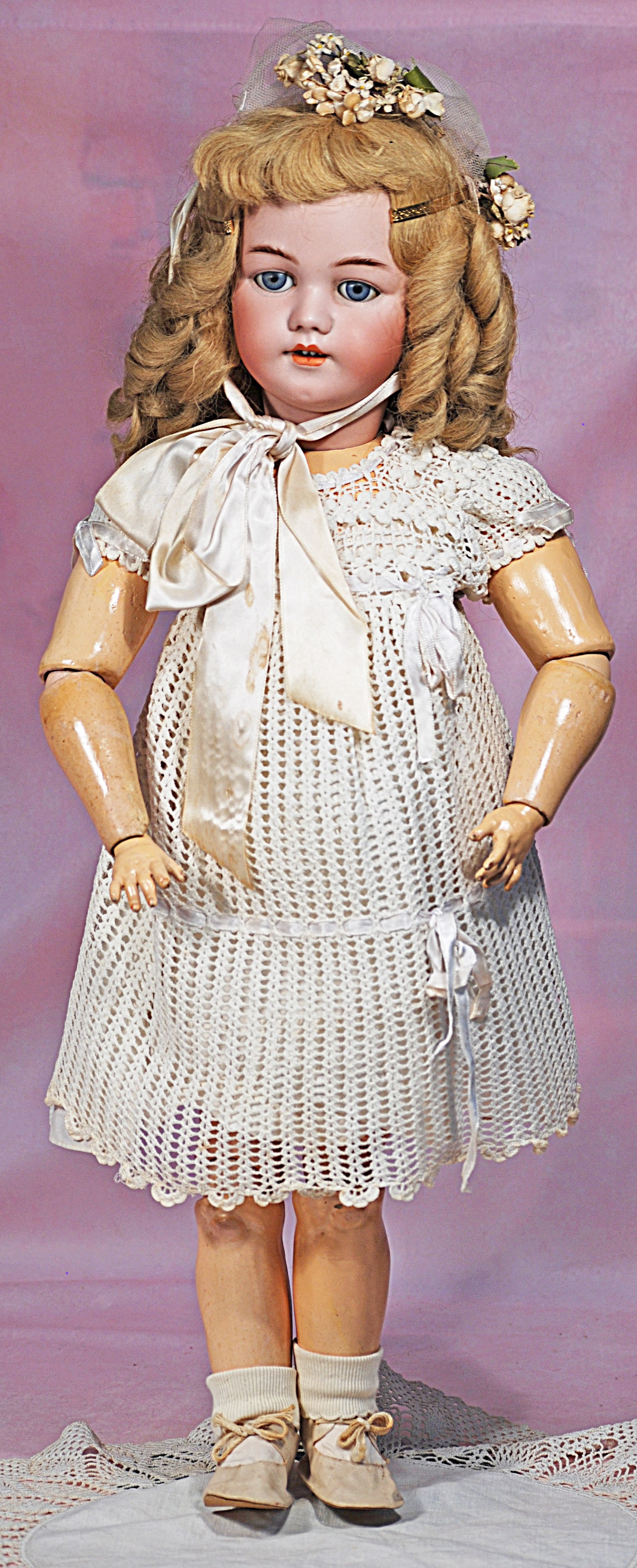 GERMAN BISQUE CHILD, MODEL 1249, BY SIMON & HALBIG.: 20. GERMAN BISQUE CHILD, MODEL 1249, BY SIMON & HALBIG. 25”. Marks: S & H 1249 Dep Germany. Bisque socket head, blue sleep eyes, painted lashes, molded and feathered brows, pierced ears, open mo