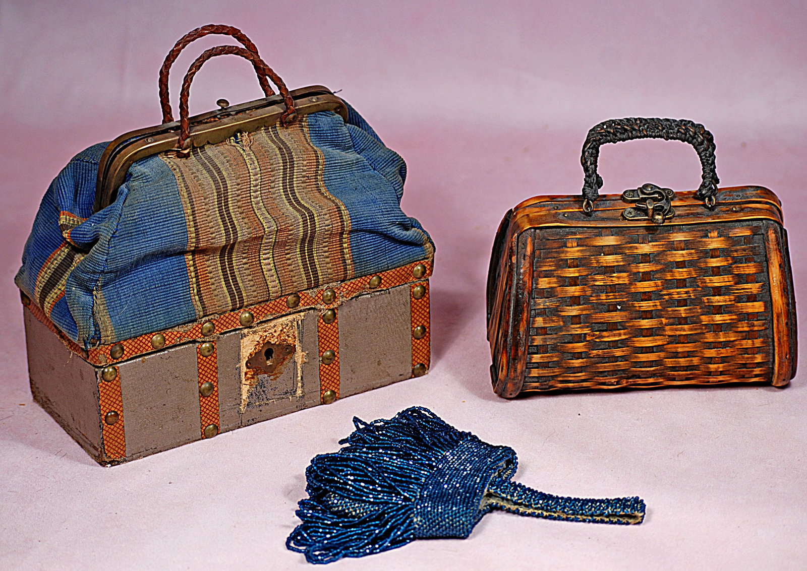 FRENCH SAC DUVOAGE TRAVEL CASE AND DOLL PURSES.: 60. FRENCH SAC DUVOAGE TRAVEL CASE AND DOLL PURSES. Classic 7” travel case known as "sac du voyage" has wooden base with studded borders, and woven tapestry top with brass frame and leather hand