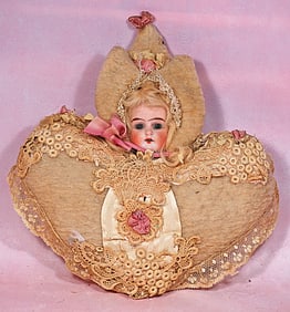 BISQUE-HEAD DOLL PILLOW PINCUSHION.