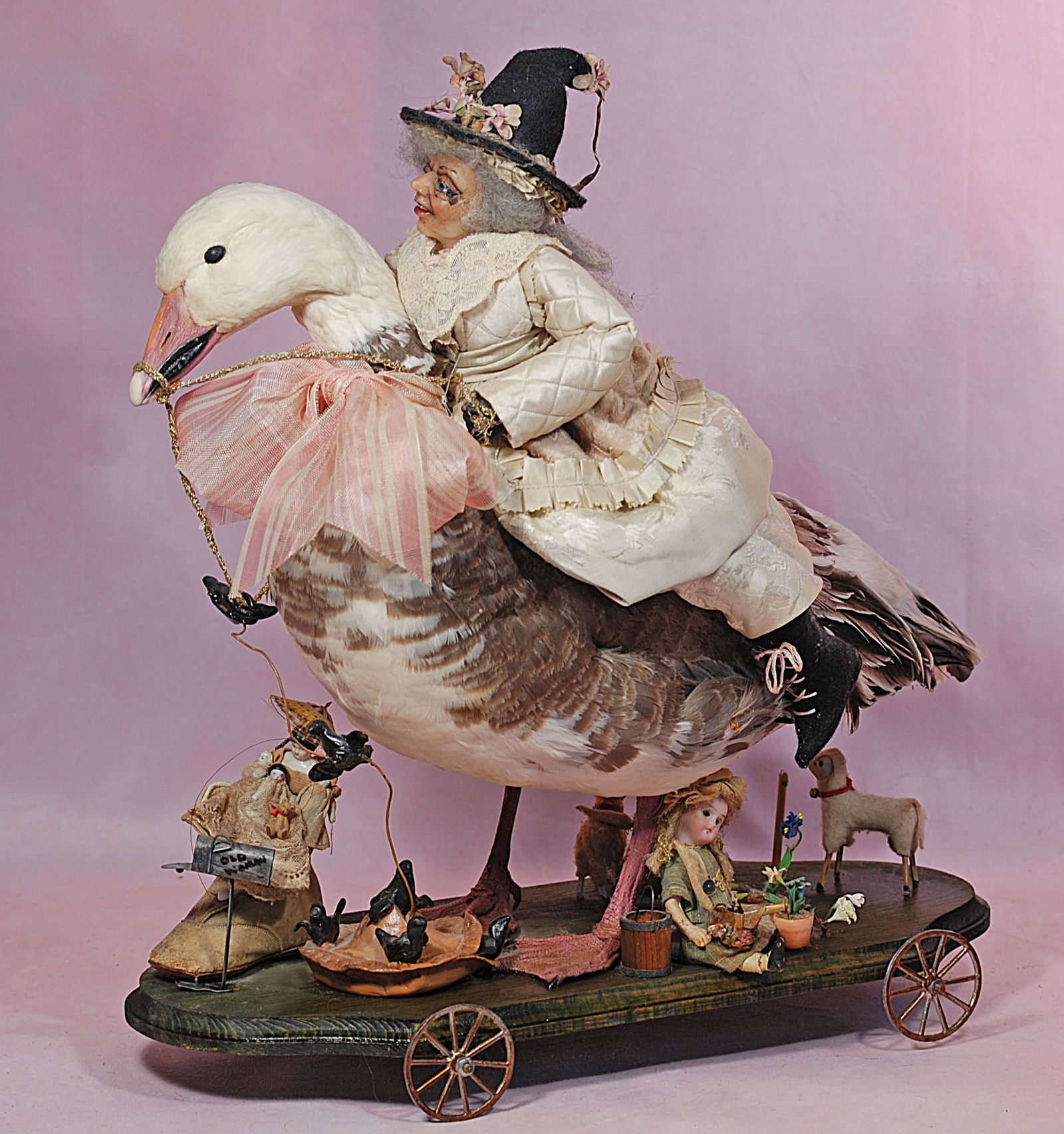 MOTHER GOOSE, NURSERY RHYME WHEELED TOY. (1 of 2)