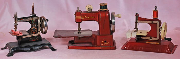 THREE TOY SEWING MACHINES.