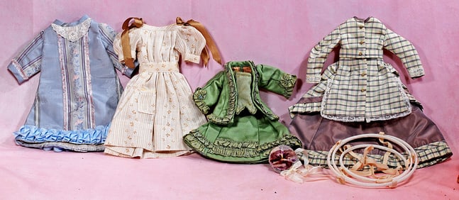 FOUR DOLL DRESSES.