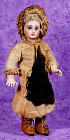 PETITE SIZE 1 FRENCH-TYPE BISQUE DOLL IN ORIGINAL COSTUME.
