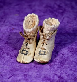 PAIR OF ANTIQUE DOLL BOOTS WITH CROCHETED SOCKS.