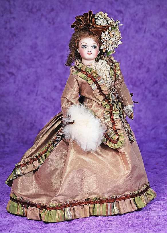 PETITE FRENCH BISQUE POUPEE BY JUMEAU.: PETITE FRENCH BISQUE POUPEE BY JUMEAU. 12”. Bisque swivel head on bisque shoulderplate, almond-shaped blue paperweight eyes, painted lashes, eyeliner, feathered brows, pierced ears, closed mouth