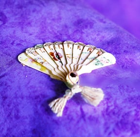 MINIATURE CELLULOID DOLL FAN.