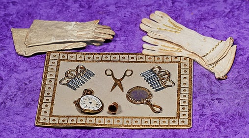 DOLL ACCESSORIES ON ORIGINAL CARD AND TWO PAIR OF GLOVES.