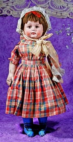 ALABAMA BABY DOLL WITH WIG AND BLUE BOOTS.