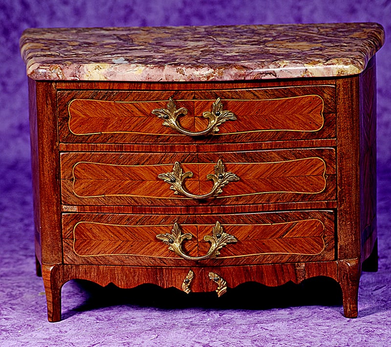 FRENCH MAITRISE CHEST IN ELEGANT LOUIS VX STYLE.: FRENCH MAITRISE CHEST IN ELEGANT LOUIS VX STYLE. 7 ½” x 10 ½”. Wooden chest with inlay grained rosewood panels, richly patterned marble top, three drawers with bronze drawer pull