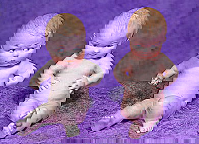 PAIR OF GERMAN ALL-BISQUE SEATED CHARACTERS BY GEBRUDER HEUBACH.