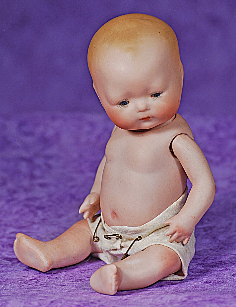 RARE ALL-BISQUE TYNIE BABY BY HORSMAN.: RARE ALL-BISQUE TYNIE BABY BY HORSMAN. 7 ½”. Marks: c. 1924 by E.I. Horsman Co. Inc. Made in Germany. Solid domed bisque socket head on bisque torso, painted blonde baby hair and brows, tin