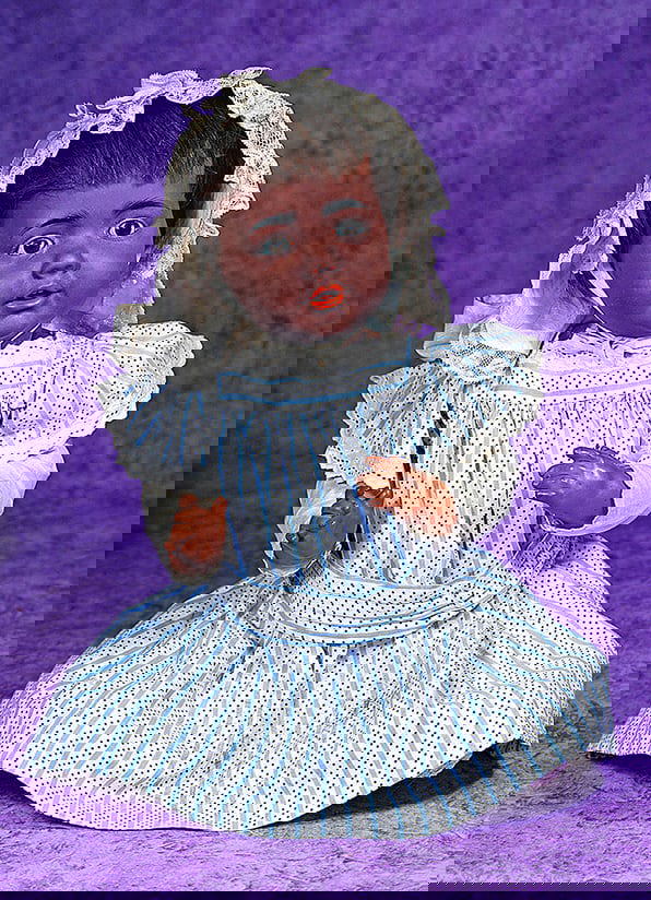 RARE GERMAN BISQUE BABY HILDA BY KESTNER WITH RICH BROWN COMPLEXION.: RARE GERMAN BISQUE BABY HILDA BY KESTNER WITH RICH BROWN COMPLEXION. 18”. Marks: K made in Germany 14 JDK Jr. c. 1914 Hilda Ges Gesch (head) 46 (impressed on back torso). Bisque socket head, bro