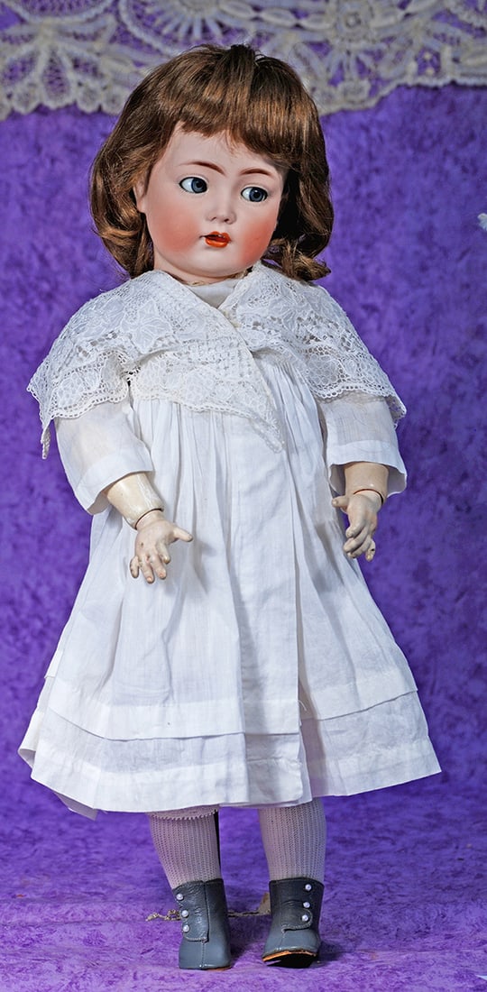 GERMAN BISQUE FLIRTY-EYED MEIN LIEBLING BY KAMMER AND REINHARDT.: GERMAN BISQUE FLIRTY-EYED MEIN LIEBLING BY KAMMER AND REINHARDT. 22”. Marks: K * R Simon & Halbig 117n. Bisque socket head, brown flirty and sleep eyes, painted lashes, eyeliner, feathered brows