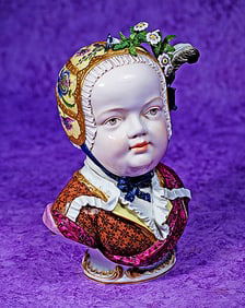 FINE GERMAN PORCELAIN DRESDEN BUST OF CHILD IN ORNATE CAP.