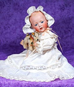 GERMAN BISQUE HILDA BABY BY KESTNER WITH STEIFF PUP.
