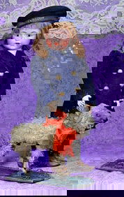 FLEECY LAMB PULL TOY ON WOODEN PLATFORM.