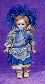 PETITE GERMAN BISQUE CLOSED-MOUTH DOLL BY GEBRUDER KUNLENZ.