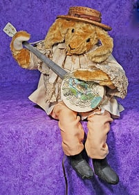 LARGE MECHANICAL MOHAIR RABBIT WITH STYLIZED GUITAR.