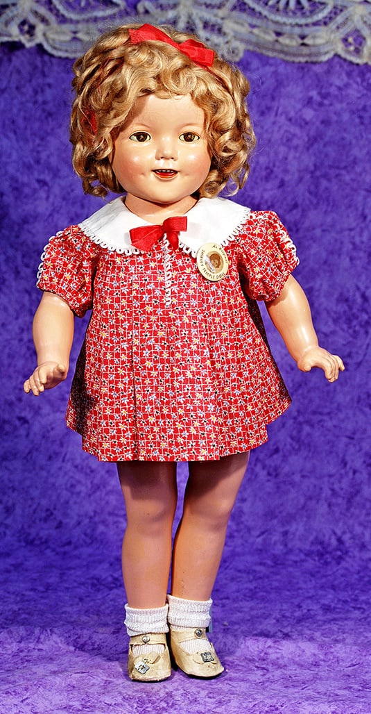 COMPOSITION SHIRLEY TEMPLE DOLL BY IDEAL IN ORIGIANAL COSTUME.: COMPOSITION SHIRLEY TEMPLE DOLL BY IDEAL IN ORIGIANAL COSTUME. 22”. Marks: Shirley Temple, Ideal . Composition socket head on five-piece jointed composition body, sleep eyes, painted lower lashe