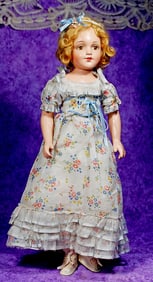 AMERICAN COMPOSITION DOLL IN ORIGINAL GOWN.