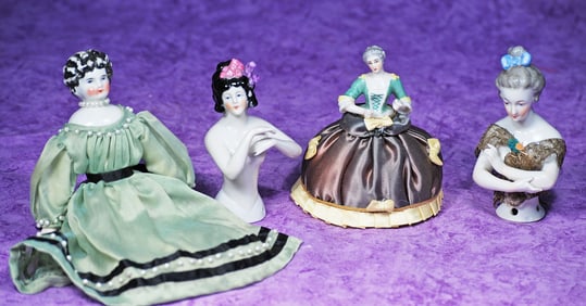 THREE GERMAN PORCELAIN HALF DOLLS AND CHINA DOLL.