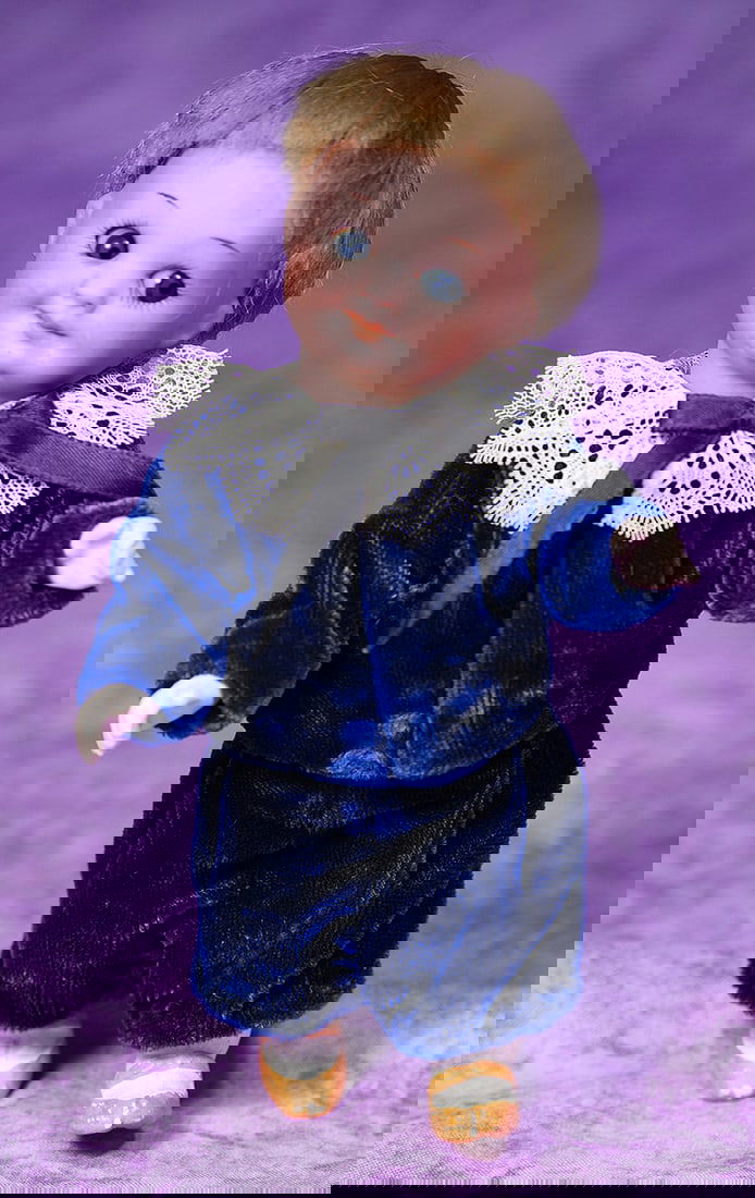 GERMAN BISQUE GOOGLY BY MARSEILLE.: GERMAN BISQUE GOOGLY BY MARSEILLE. 7”. Marks: Germany 323 A/11/M. Bisque socket head, blue sleep and side-glancing googly eyes, painted lashes and brows, closed mouth, original blonde mohair wig