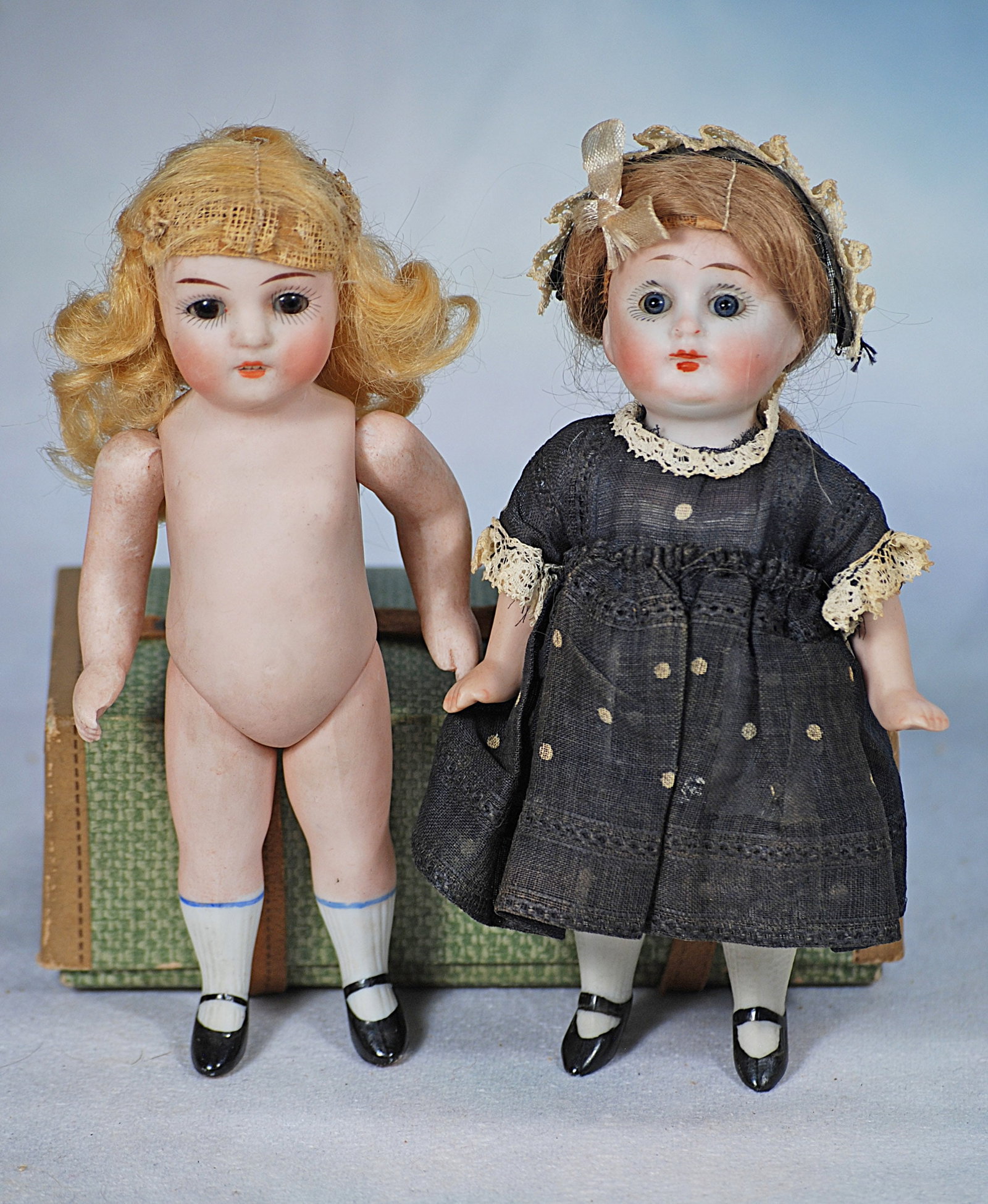 TWO GERMAN ALL-BISQUE DOLLS. (1 of 1)
