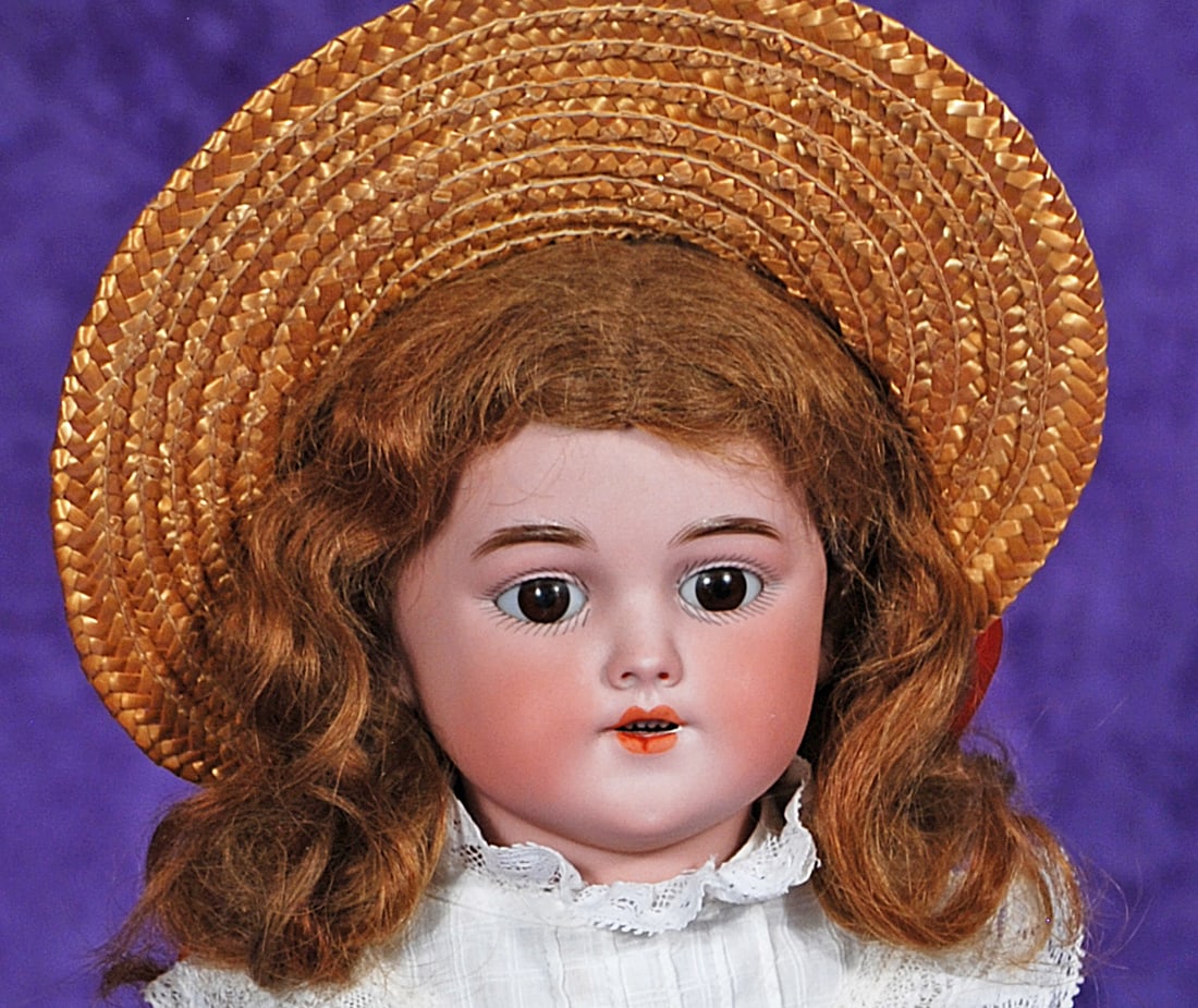 GERMAN BISQUE CHILD, MODEL 1250, BY SIMON AND HALBIG: 21. GERMAN BISQUE CHILD, MODEL 1250, BY SIMON AND HALBIG. 16”. Marks: 1250 Simon & Halbig Germany. Bisque shoulderhead, stationary brown glass eyes, painted lashes, feathered brows, pierced ears