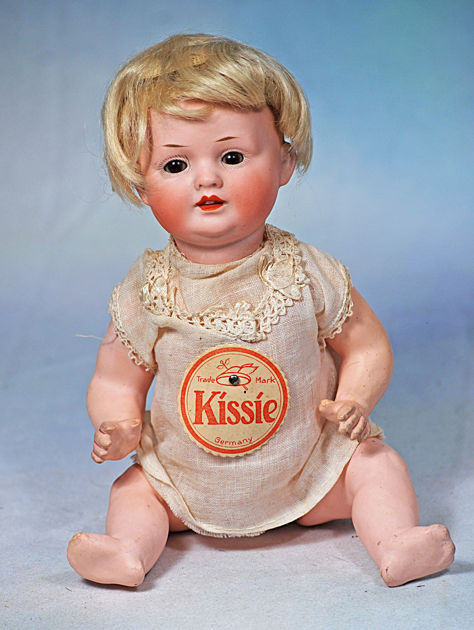 GERMAN BISQUE “KISSIE” CHARACTER BY BAHR AND PROSCHILD: 27. GERMAN BISQUE “KISSIE” CHARACTER BY BAHR AND PROSCHILD. 9 ½”. Marks: BPO 585 Germany. Bisque socket head, brown sleep eyes, painted lashes, tapered brows, open/closed mouth wi