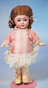 PETITE GERMAN BISQUE CHRACTER BY FRANZ SCHMIDT WITH TODDLER BODY.