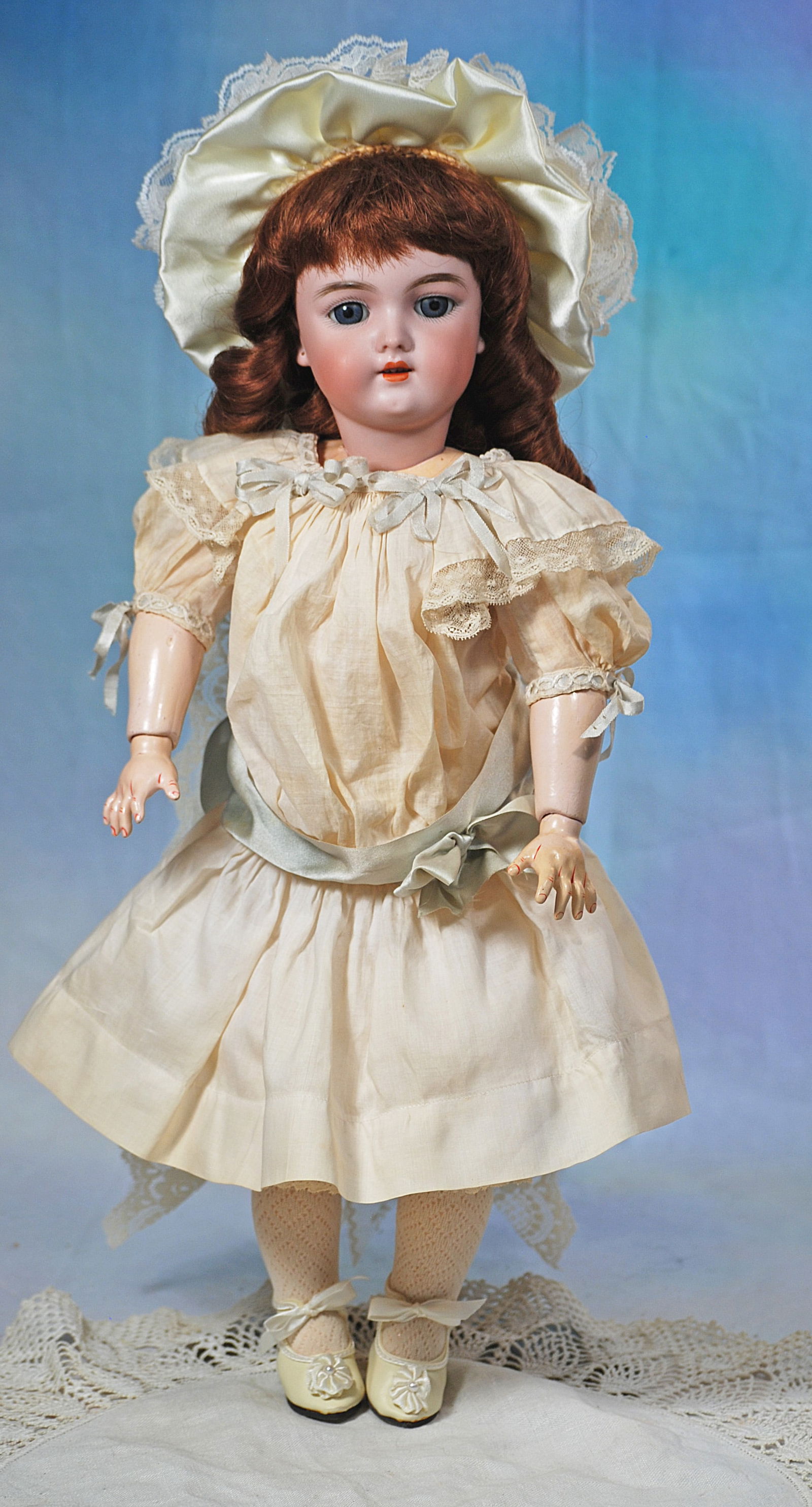 GERMAN BISQUE CHILD, MODEL 109, BY HANDWERCK.: 32. GERMAN BISQUE CHILD, MODEL 109, BY HANDWERCK. 17”. Marks: 109 7 ½ Germany Handwerck. Bisque socket head, stationary blue glass eyes, painted lashes, feathered brows, pierced ears, ope