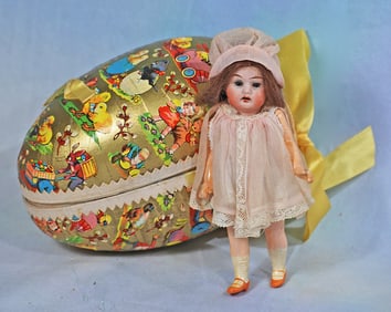 MINIATURE GERMAN BISQUE DOLL IN PRESENTATION EGG.