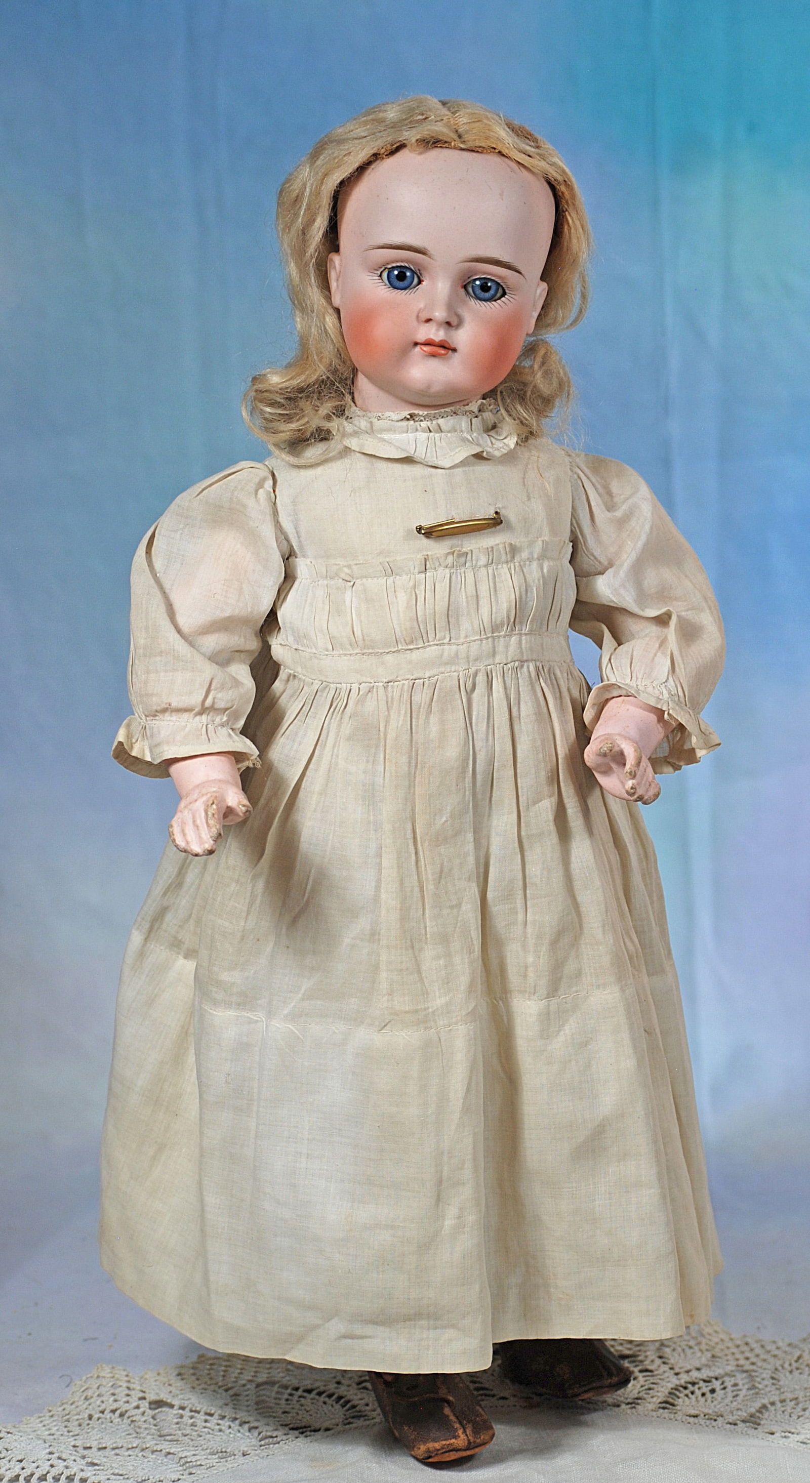 GERMAN BISQUE CLOSED MOUTY POUTY CHILD BY KESTNER: 44. GERMAN BISQUE CLOSED MOUTY POUTY CHILD BY KESTNER. 19 ½”. Marks: 10 Bisque socket head, blue sleep eyes, painted lashes, feathered brows, un-pierced ears, closed mouth, accented lips,