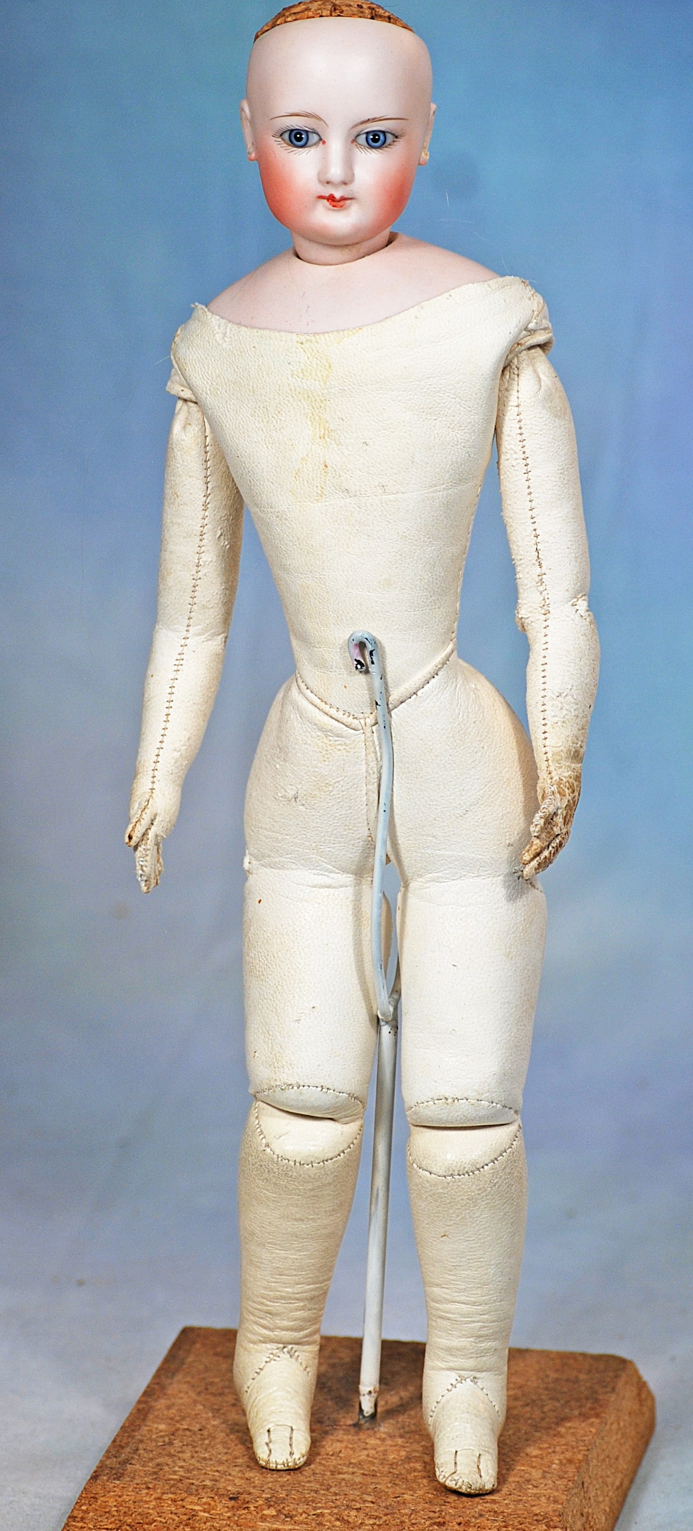 PETITE FRENCH BISQUE POUPEE BY GAULTHIER.: 45. PETITE FRENCH BISQUE POUPEE BY GAULTHIER. 13”. Marks:1. Bisque swivel head on bisque shoulderplate, blue paperweight eyes, painted lashes, eyeliner, feathered brows, pierced ears, closed mou