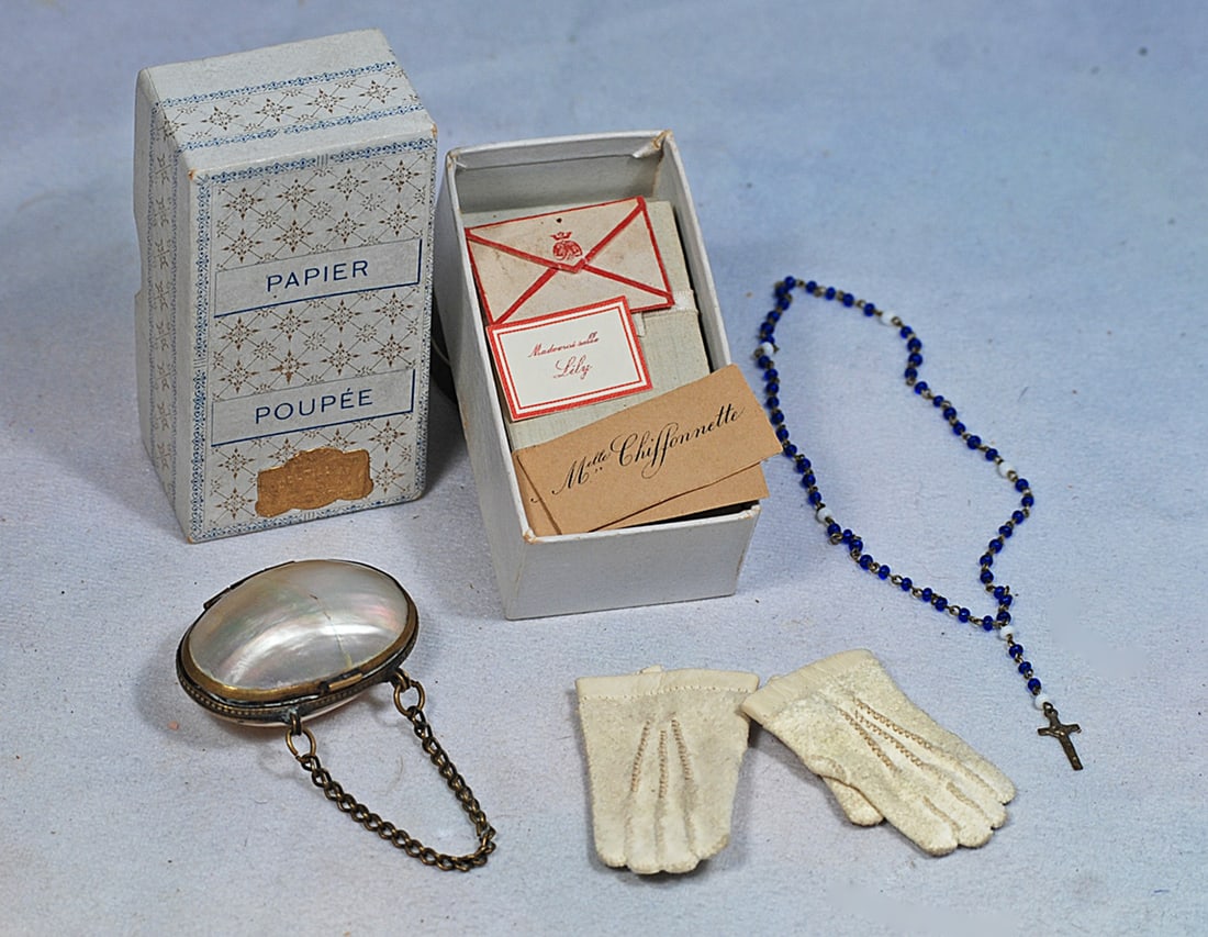 FRENCH PAPIER SET AND ACCESSORIES: 3” x 1 1/2” box labeled “Paper Poupee” with envelopes, paper, and two calling cards for “Chiffonnette” and tiny envelopes and card for “Lily”; pair of