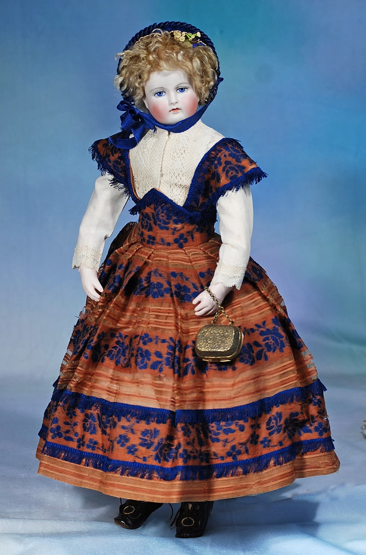 LOVELY FRENCH BISQUE POUPEE BY LEONTINE ROHMER: 17”. Marks: Rohmer green oval stamp on torso. Bisque swivel head with flat-cut neck socket attached to bisque shoulderplate by metal pin in pate, rounded face with plump cheeks,