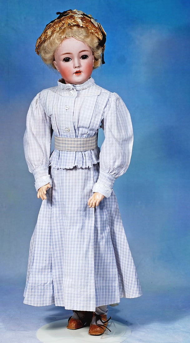 GERMAN BISQUE LADY DOLL, MODEL 1159, BY SIMON AND HALBIG: 22”. Marks: 1159 Simon & Halbig S & H. Bisque socket head, brown sleep eyes, painted lower lashes, applied upper lashs, feathered brows, pierced ears, open mouth, shaded and accented