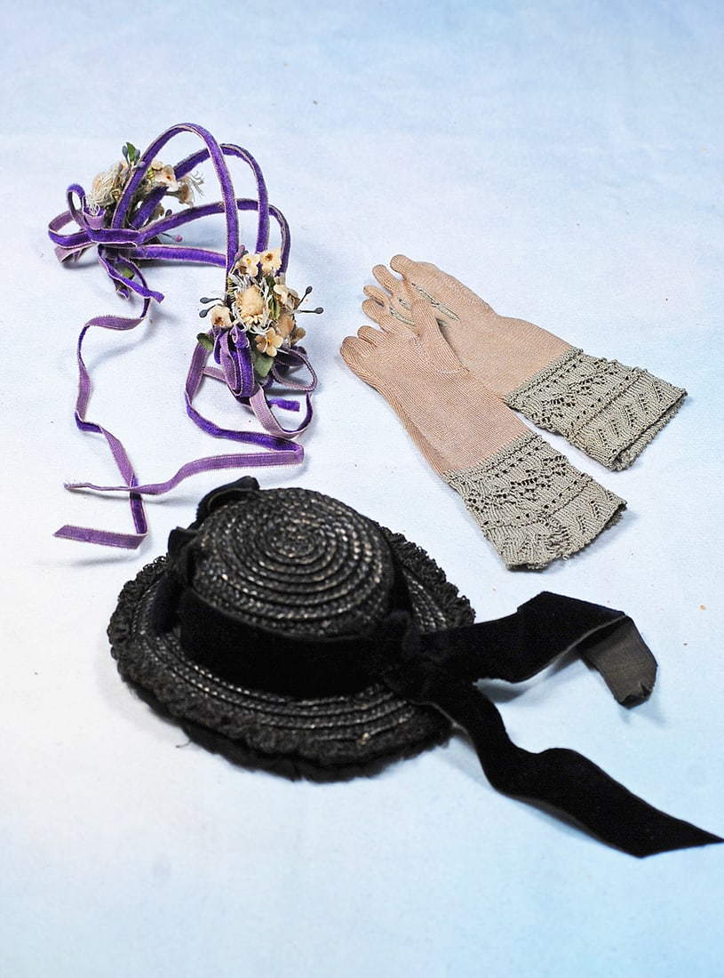 ACCESSORIES FOR POUPEE: Woven black straw bonnet with pleated black sheer brim, velvet band and ribbons for about 6”-7” head circumference; lavender velvet four wire headband with clusters of tiny flowers each