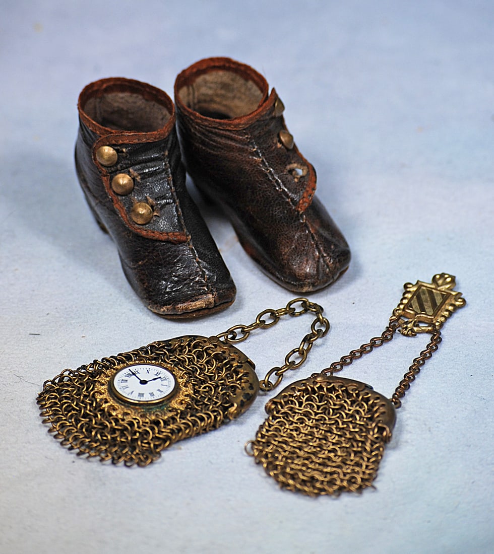 ANTIQUE DOLL BOOTS AND TWO SMALL DOLL PURSES: Pair of 2” dark brown leather ankle boots with side button closing and wooden heels; 3 ½” L. gilt mesh purse with link chain and belt hook; 3 ¼” L. gilt mesh purse with