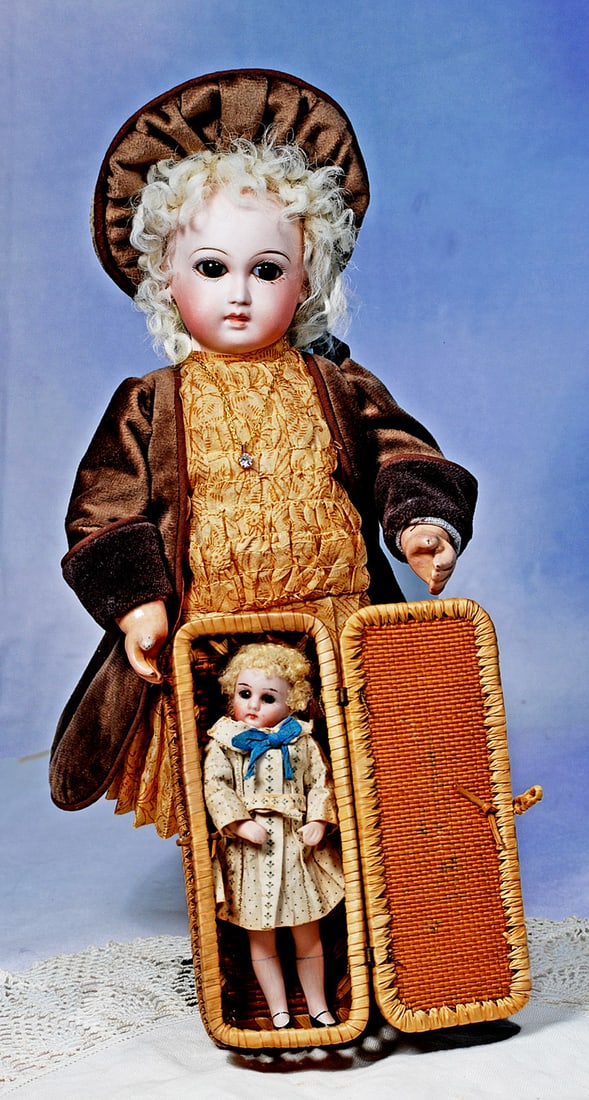 PRECIOUS LITTLE PREMIERE BEBE BY EMILE JUMEAU: 12”, Marks: None. Bisque socket head, brown paperweight eyes, painted lashes, eyeliner, feathered brows, pierced ears, closed mouth with thin modeled white space between shaded lips,